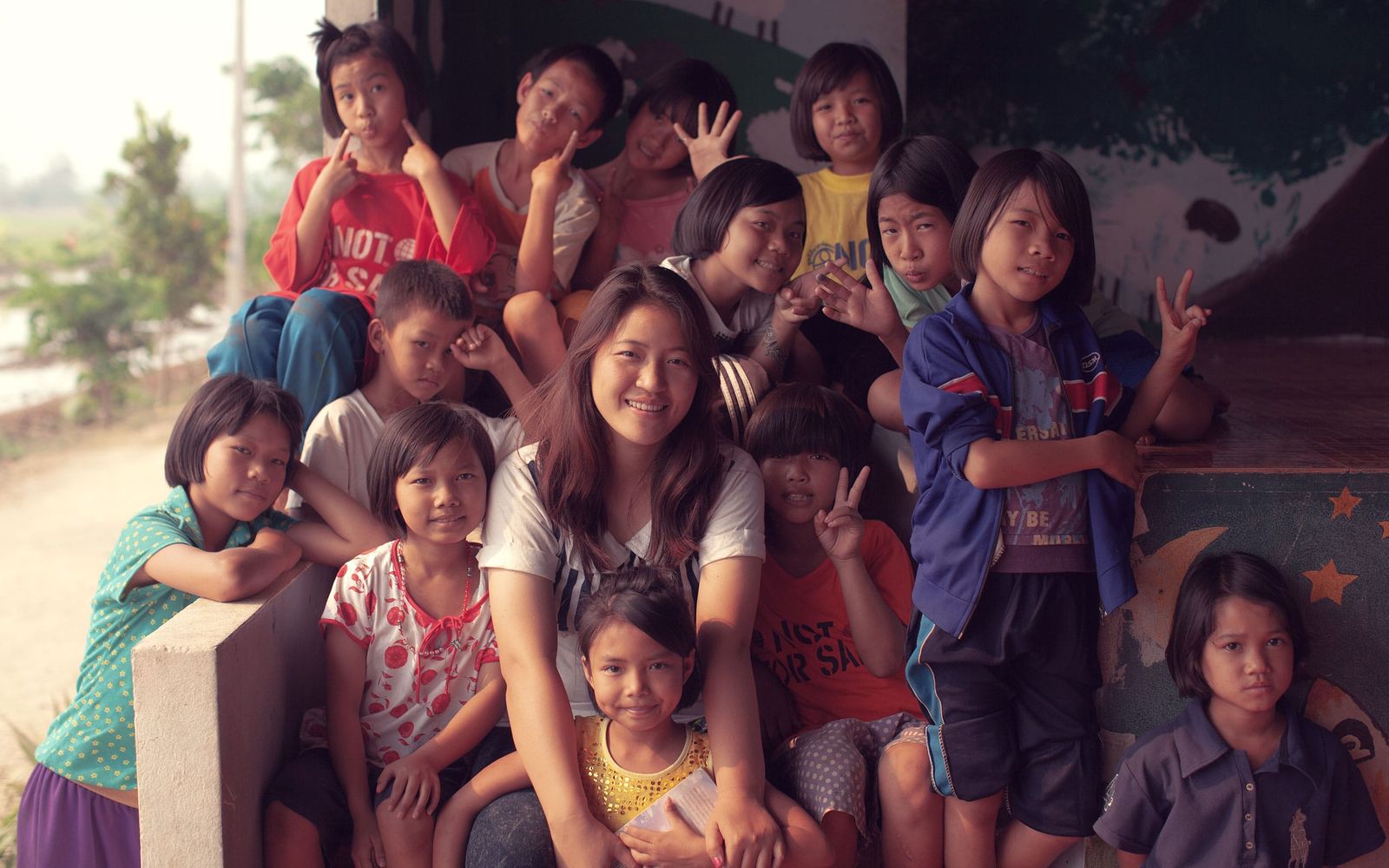 Group photo of MeTa and some of the street kids taken at the Not For Sale house.