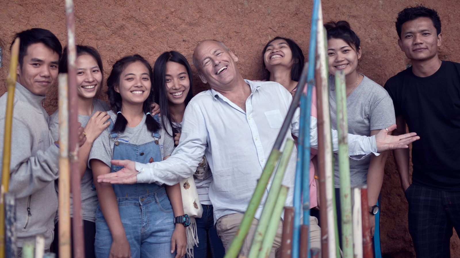 Group photo of David Batstone and some of the students taken at the Not For Sale village.