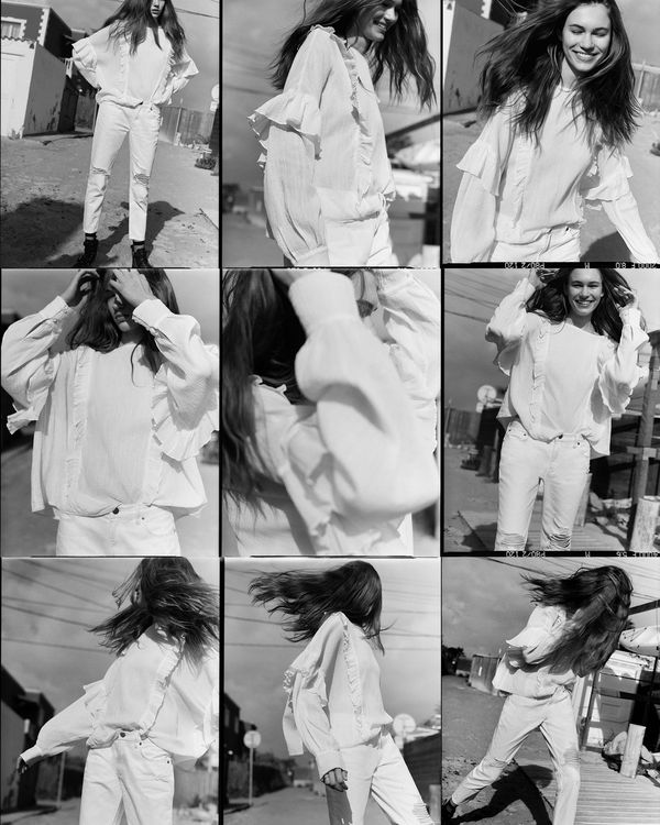 A series of playful black and white photographs from our latest campaign, depicting a woman moving in a billowing frilled top.