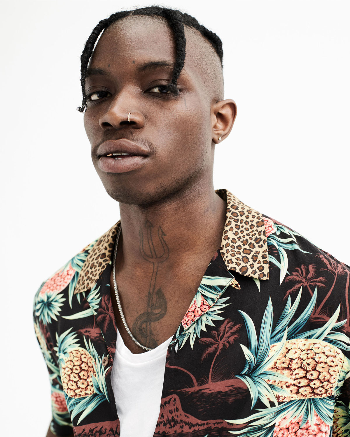 Close-up portrait of a young man from our new Biker Portraits series, wearing a Hawaiian printed shirt from our latest collection.