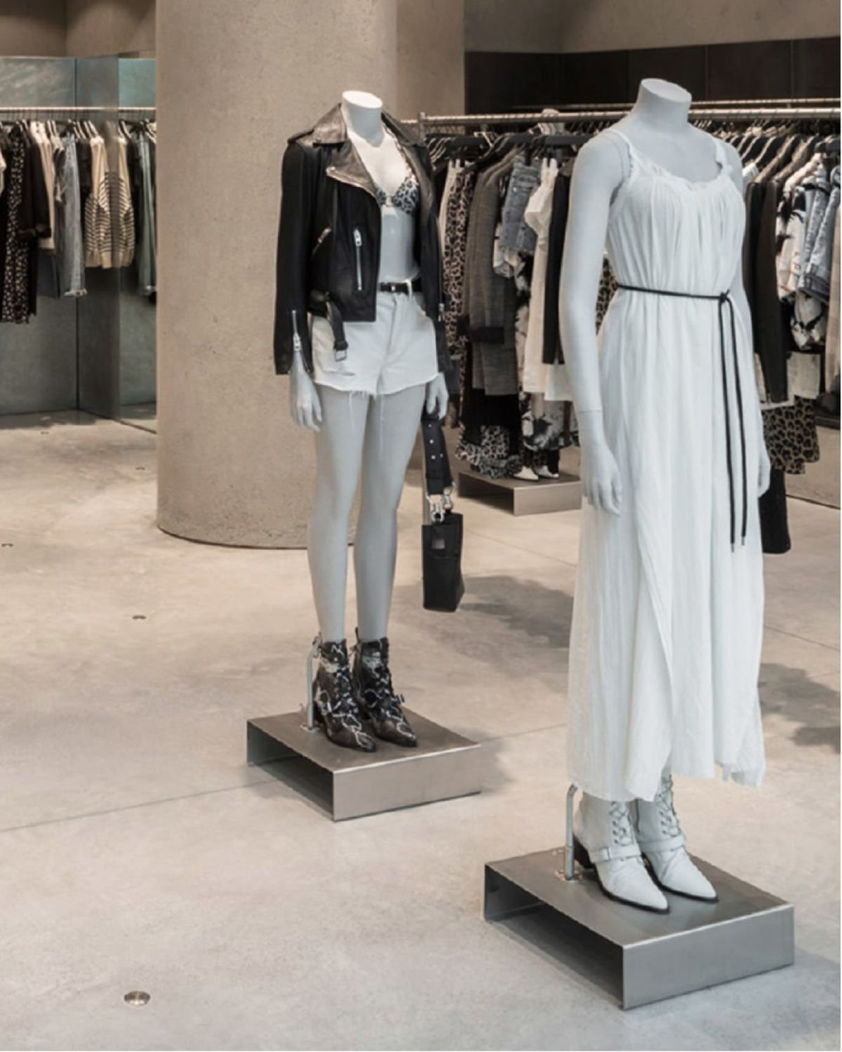 Two mannequins inside a store wearing items from our women's collection.