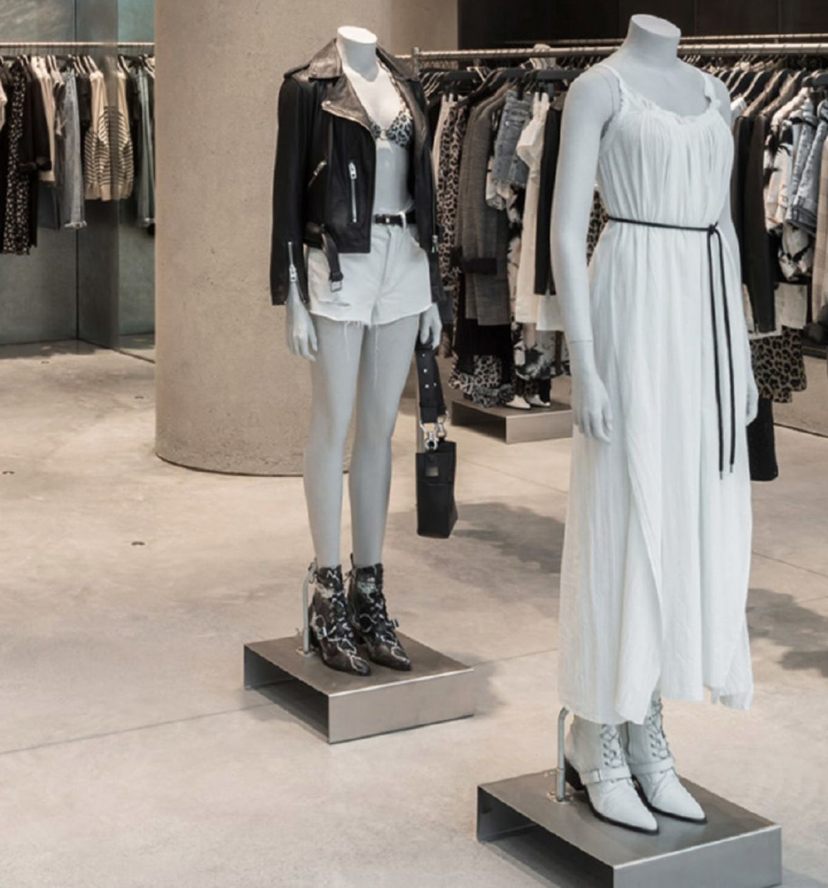 Two mannequins inside a store wearing items from our women's collection.