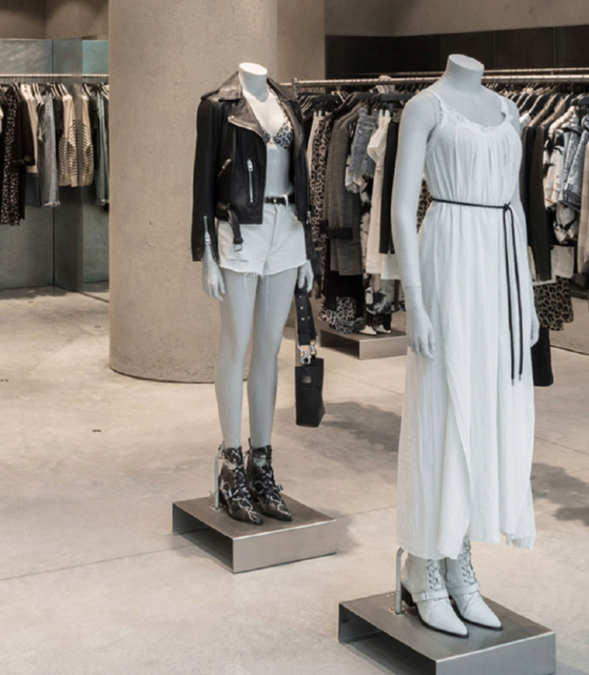Two mannequins inside a store wearing items from our women's collection.