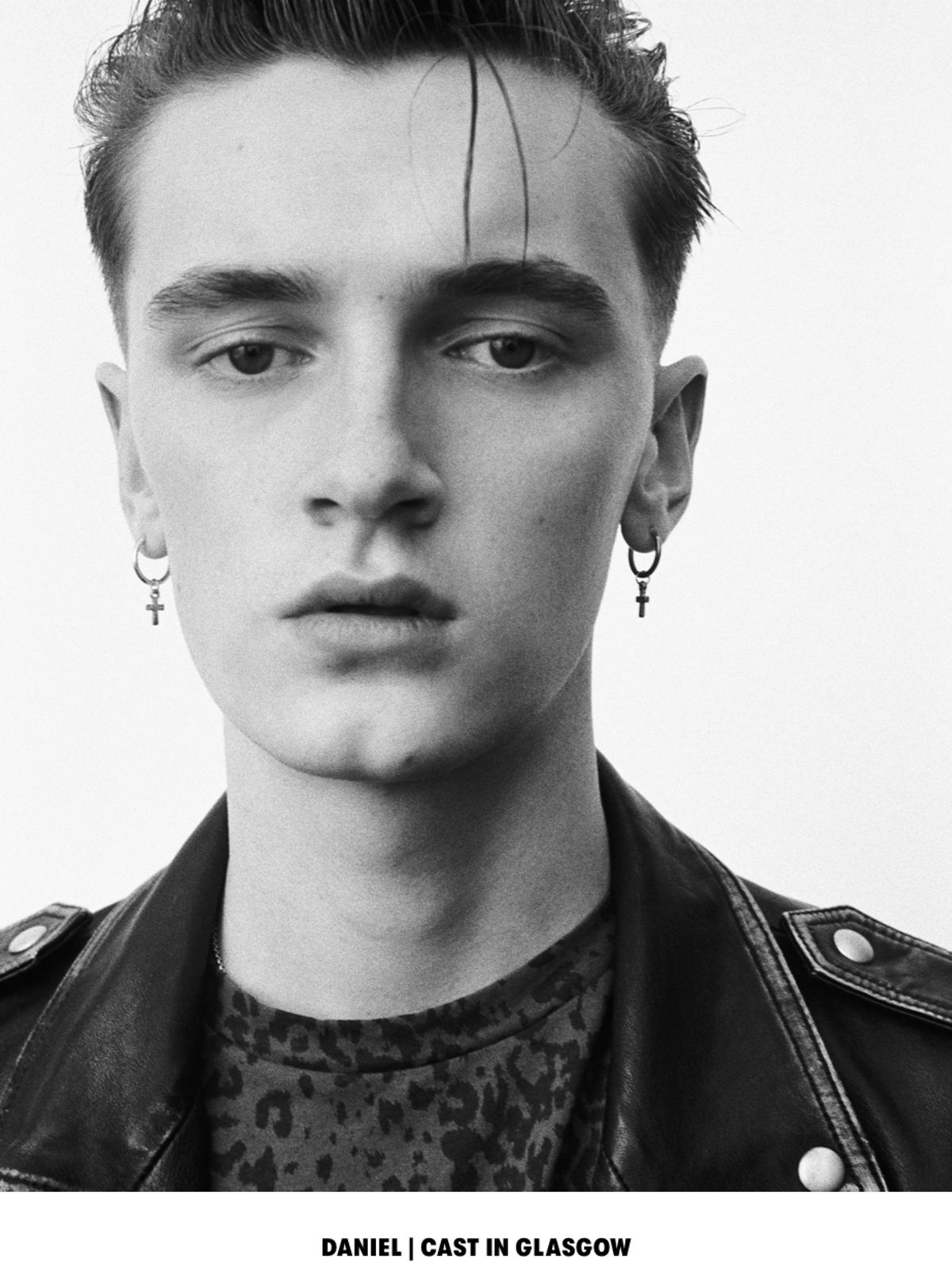 DANIEL | CAST IN GLASGOW. Black and white close up portrait of a man wearing a leopard printed t-shirt with a black leather jacket.