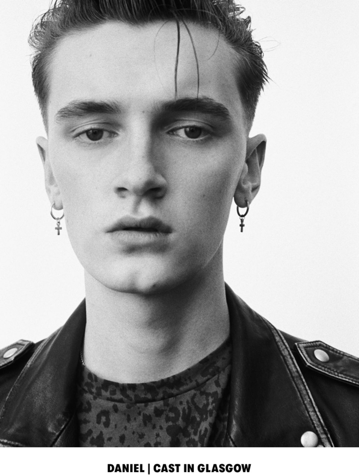DANIEL | CAST IN GLASGOW. Black and white close up portrait of a man wearing a leopard printed t-shirt with a black leather jacket.