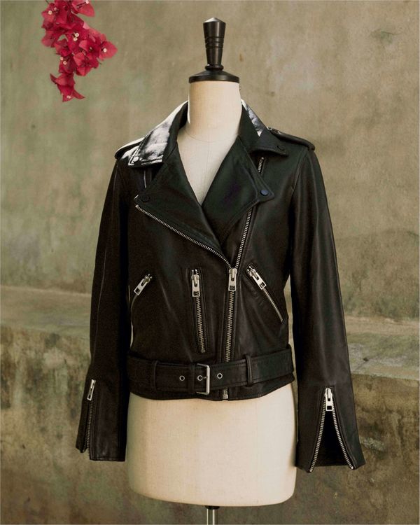 A black Balfern, our signature leather jacket, is on a wood mannequin for last quality checks.