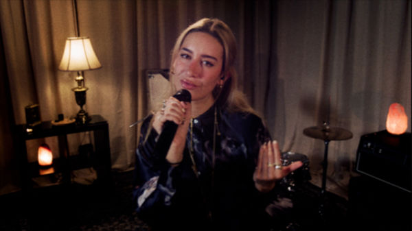 Close up shot of Julia Wolf singing.
