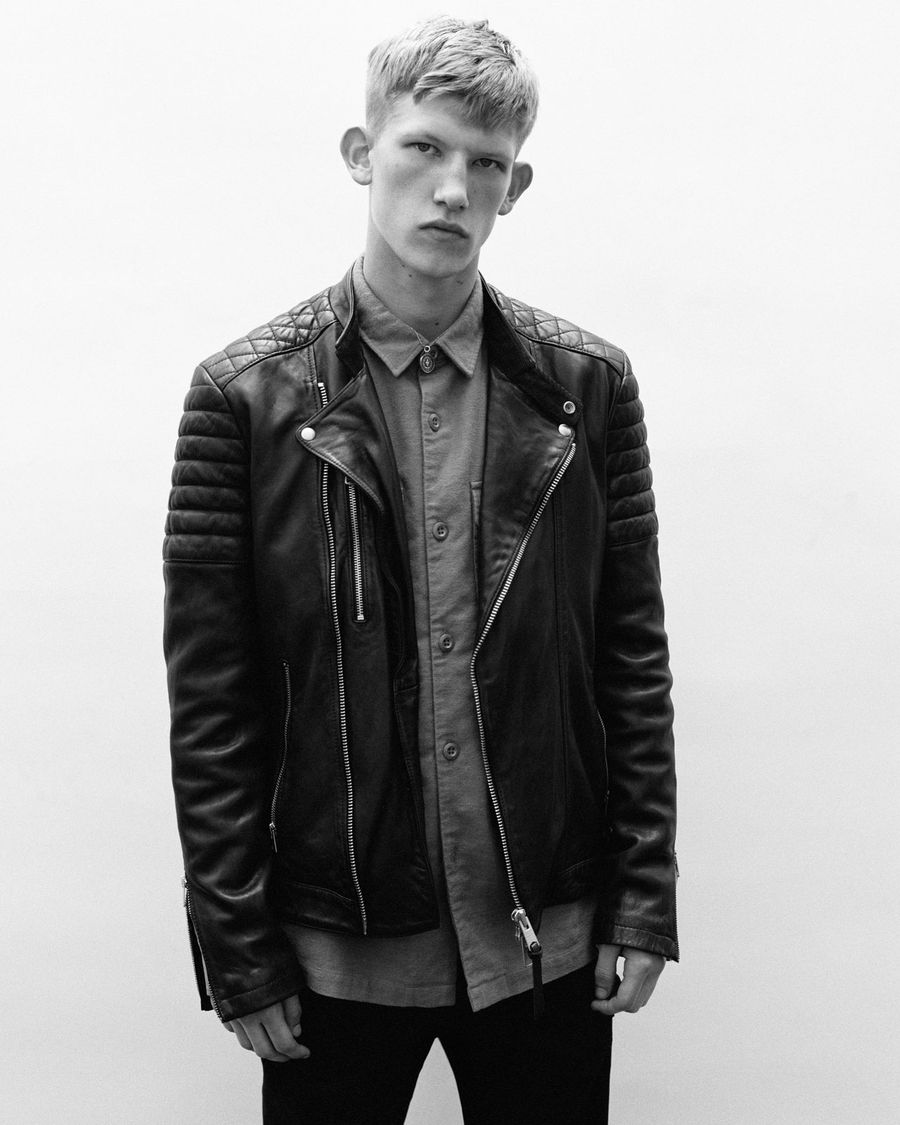 Allsaints Uk Iconic Leather Jackets Clothing Accessories Black And White Campaign Image Of A Man Wearing Leather Biker Jacket Over