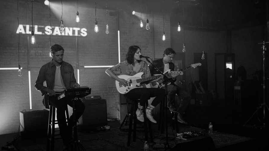 Black and white picture of K. Flay and her band playing during our latest La sessions recording and wearing items from our women's and men's collections.